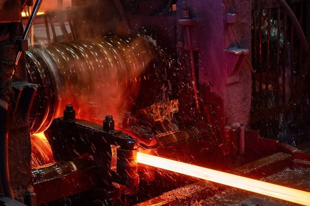 A rolling mill in operation during the manufacturing process of hot rolled steel.